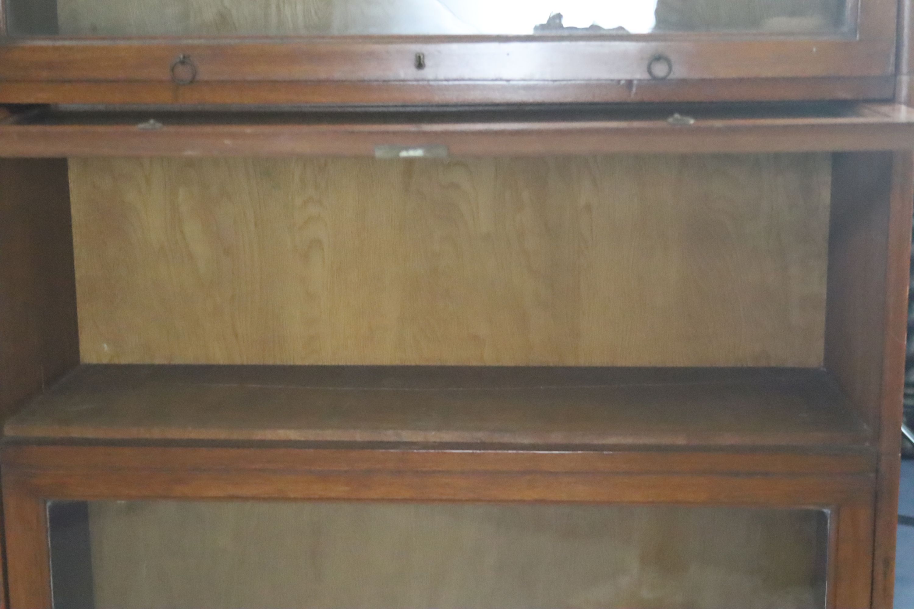 A pair of Globe Wernicke style oak sectional bookcases, W.91.5cm D.32cm H.168cm